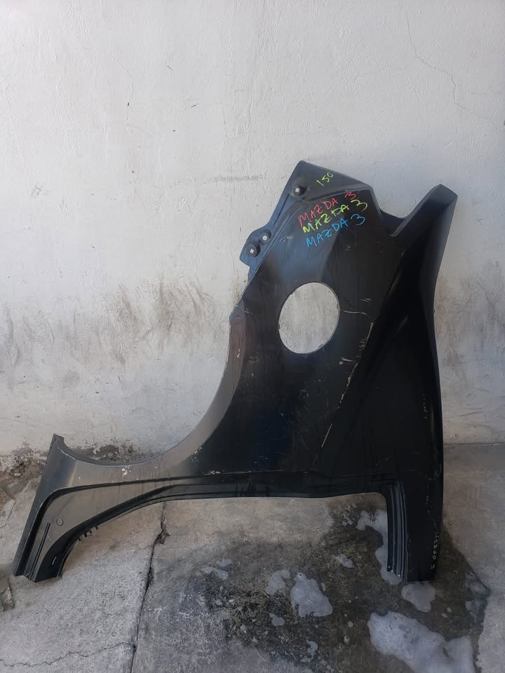 Cuarto de pollo Mazda 3